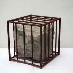 B01, Untitled, stone in steel cage, 40x40x40cm, 1990